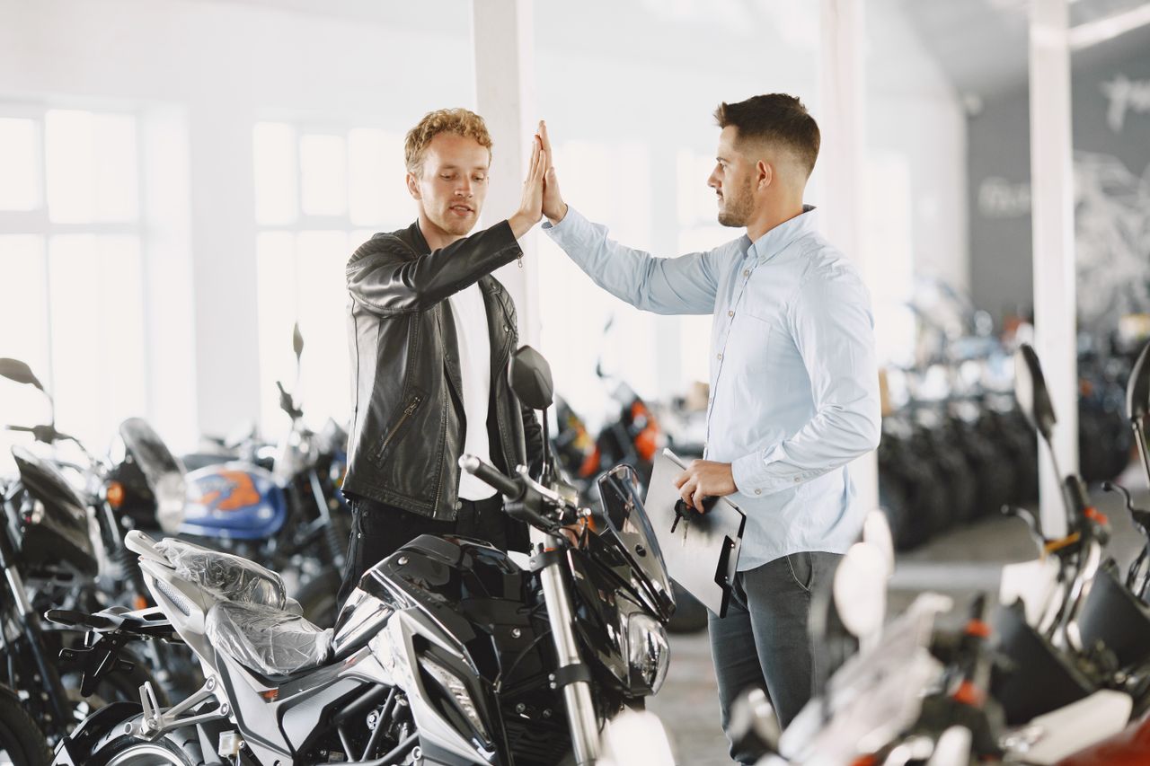 Handover conversation taking place in the Blackburn showroom