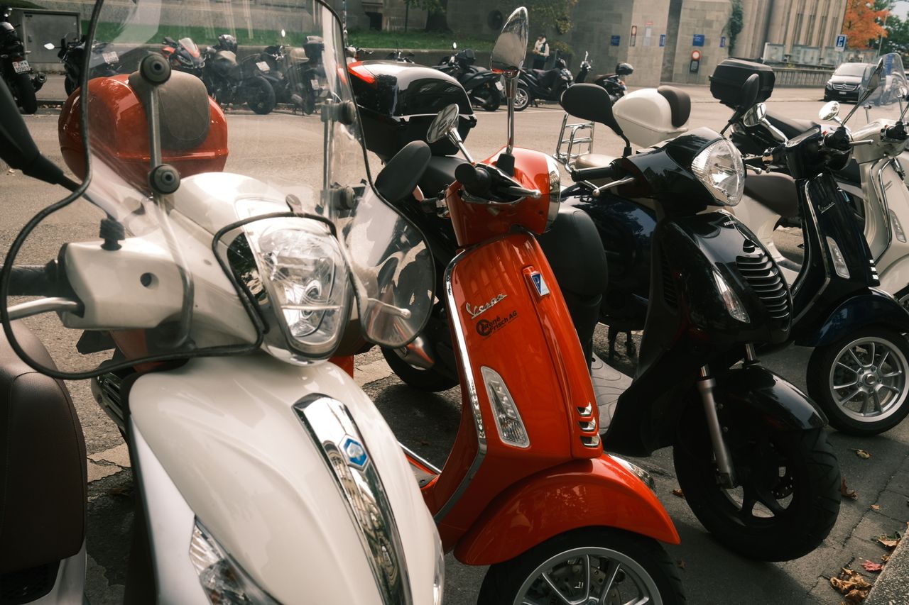 Scooters lined up on the yard at Hamilton Street Motors, available to view